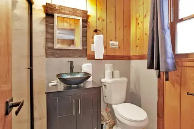 a bathroom with a toilet and a sink at Shore acres lodge #450 in Big Bear Lake