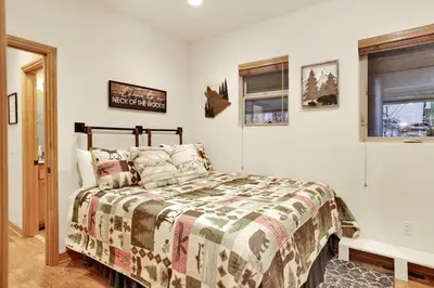 a bedroom with a bed and a window at The spa at winterset #2282 in Big Bear Lake