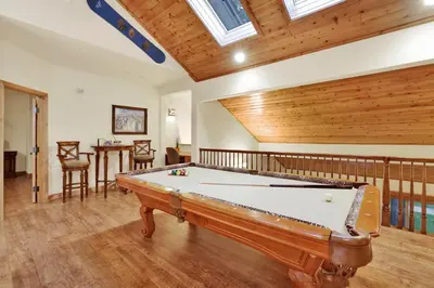 a pool table in a room with wooden ceilings at The spa at winterset #2282 in Big Bear Lake