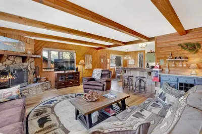 a living room with a couch and a table at Mockingbird mountain getaway #2380 in Big Bear Lake