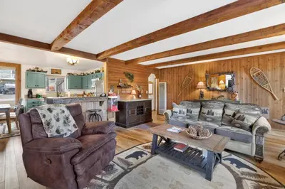 a living room with a couch and a table at Mockingbird mountain getaway #2380 in Big Bear Lake