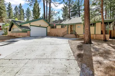 a house with a driveway with a garage at Cozy up to summit #1651 in Big Bear Lake