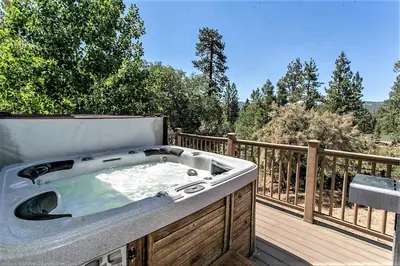 a hot tub on the deck of a house at Grandpas axe # 1775 in Big Bear Lake