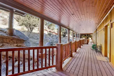 an empty porch of a house with a wood deck at Gold rush lodge #2352 in Big Bear Lake