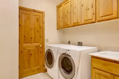 a laundry room with a washing machine and a sink at Starlight vistas #1524 in Big Bear Lake