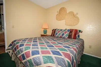 a bedroom with a bed and two hearts on the wall at Boulder creek #1417 in Big Bear Lake