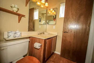 a bathroom with a sink and a toilet and a mirror at Boulder creek #1417 in Big Bear Lake