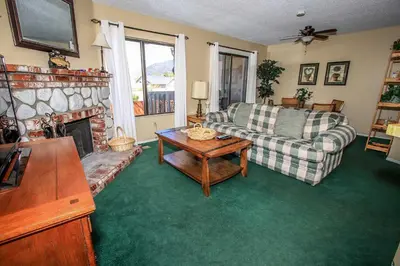 a living room with a couch and a fireplace at Boulder creek #1417 in Big Bear Lake
