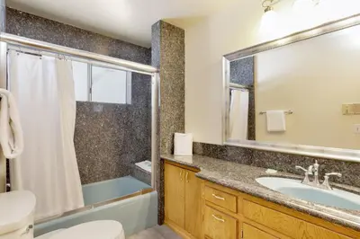a bathroom with a tub and a sink and a shower at Crestwood summit #2119 in Big Bear Lake