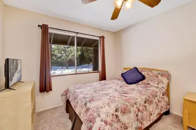 a bedroom with a bed and a window at Crestwood summit #2119 in Big Bear Lake