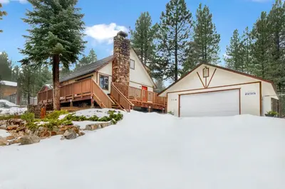 a house with a garage in the snow at Swiss delight #2244 in Big Bear Lake