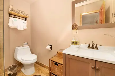a bathroom with a white toilet and a sink at Swiss delight #2244 in Big Bear Lake