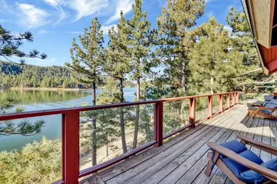 a deck with chairs and a view of a lake at Fishermans paradise #1792 in Big Bear Lake