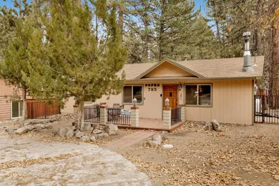 a small house with a porch and a fence at POPKO'S PLACE #1426 in Big Bear Lake