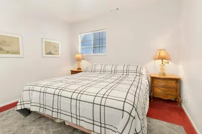 a bedroom with a bed and two night stands at Cozy summit #2222 in Big Bear Lake