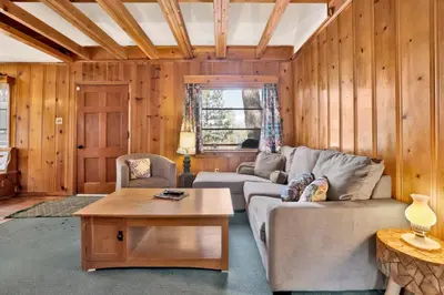 a living room with a couch and a table at Temple Lake Views#2298 in Big Bear Lake