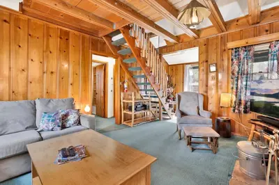 a living room with a couch and a table at Temple Lake Views#2298 in Big Bear Lake