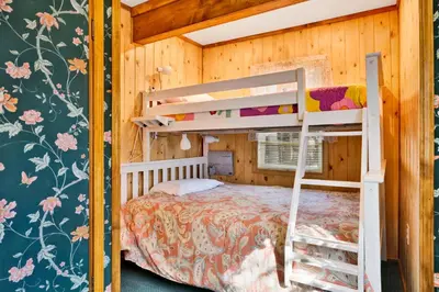 a bedroom with bunk beds in a wooden house at Temple Lake Views#2298 in Big Bear Lake