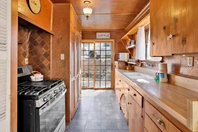 a kitchen with wooden cabinets and a stove top oven at Temple Lake Views#2298 in Big Bear Lake