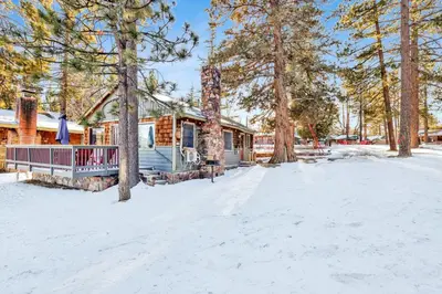 a cabin in the woods in the snow at Lakeside #109 in Big Bear Lake