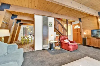 a living room with a couch and a chair at QUAIL'S CALL #2415 in Big Bear Lake