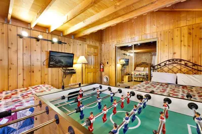 a room with a pool table with dolls on it at Oriole cottage #621 in Big Bear Lake