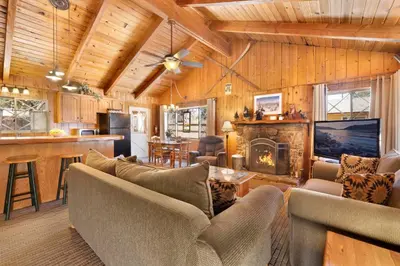 a living room with a couch and a fireplace at Oriole cottage #621 in Big Bear Lake