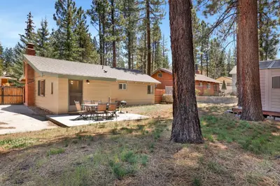 a house with a table and chairs in front of it at Oriole cottage #621 in Big Bear Lake