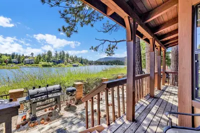 a deck with a view of a lake at Breezy two #113 in Big Bear Lake