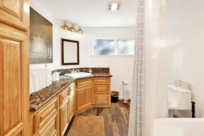 a bathroom with a sink and a bath tub at Conklin paradise #1993 in Big Bear Lake