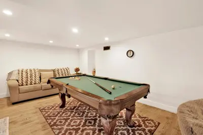 a living room with a pool table and a couch at Conklin paradise #1993 in Big Bear Lake