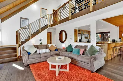 a living room with two couches and a table at Chimney Peak Chalet#2048 in Big Bear City
