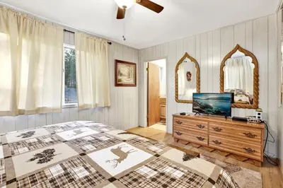 a bedroom with a bed and a television on a dresser at A hidden asset #2379 in Big Bear Lake