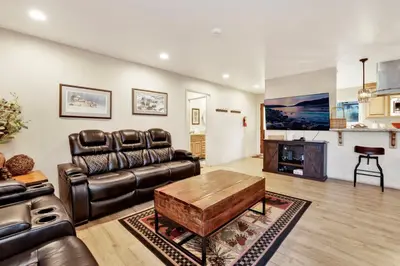 a living room with a leather couch and a table at A hidden asset #2379 in Big Bear Lake