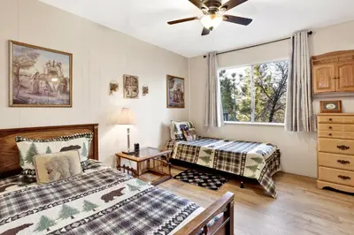 a bedroom with two beds and a ceiling fan at A hidden asset #2379 in Big Bear Lake