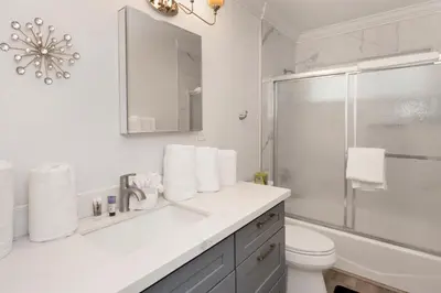 a white bathroom with a sink and a shower at Sweet retreat 2 #2333 in Big Bear Lake