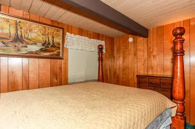 a bedroom with a bed and a painting on the wall at MAKIN' MEMORIES AT SUMMIT #1683 in Big Bear Lake