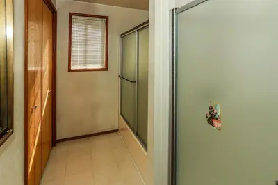a hallway with a glass door in a room at MAKIN' MEMORIES AT SUMMIT #1683 in Big Bear Lake