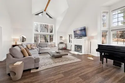 a living room with a couch and a piano at Splash mountain #1904 in Big Bear Lake
