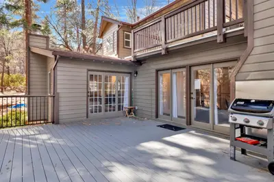 a house with a deck and a grill at Splash mountain #1904 in Big Bear Lake