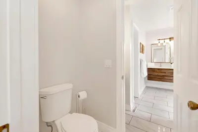 a white bathroom with a toilet and a sink at Splash mountain #1904 in Big Bear Lake