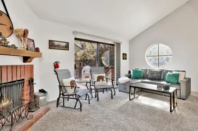 a living room with a couch and a fireplace at Restmoore #2425 in Big Bear Lake