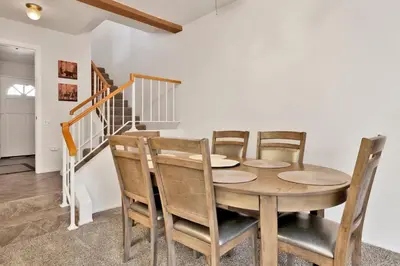 a dining room with a wooden table and chairs at Restmoore #2425 in Big Bear Lake