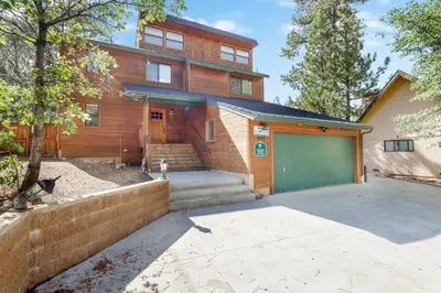 a home with a garage and a house at Luxury lodge #1888 in Big Bear Lake