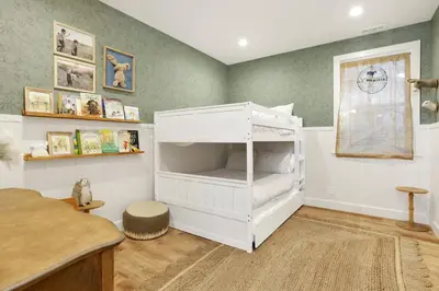 a bedroom with a white bunk bed in a room at Pine meadow village castle #2301 in Big Bear Lake