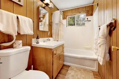 a bathroom with a toilet and a tub and a sink at Marin getaway #2013 in Big Bear Lake