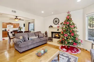 a living room with a christmas tree and a couch at Mockingbird getaway #2091 in Big Bear Lake