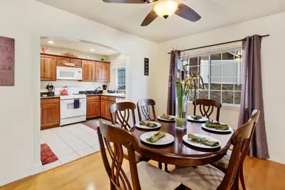 a kitchen and dining room with a wooden table and chairs at Mockingbird getaway #2091 in Big Bear Lake