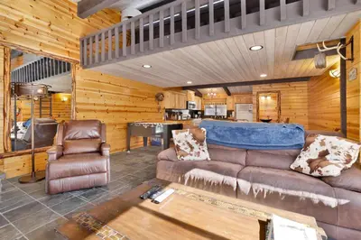 a living room with a couch and a table at Smith chalet at snow summit #2278 in Big Bear Lake