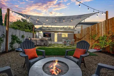a backyard with a fire pit and two chairs at Cozy Cottage, Brand New, fully Private, walk to Everything in Thousand Oaks